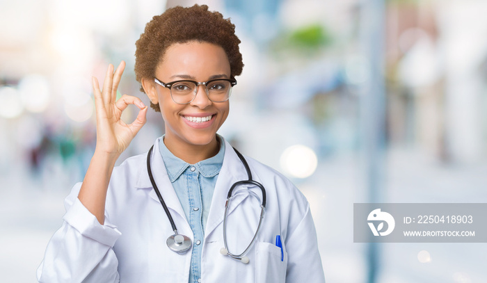 Young african american doctor woman wearing medical coat over isolated background smiling positive d