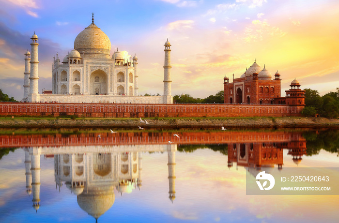 Taj Mahal Agra at sunset with water reflection and moody sky. Taj Mahal is a UNESCO World Heritage s