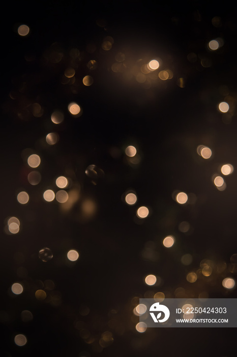 Glitter vintage lights background. dark gold and black. defocused