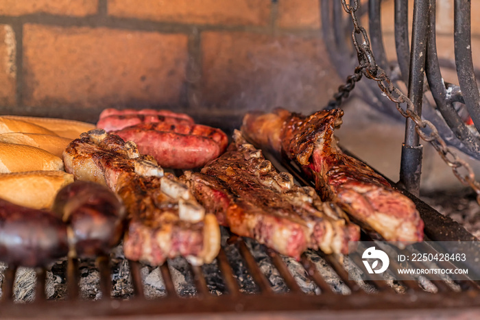 Parrillada  Argentine barbecue make on live coal (no flame), beef  asado , bread,  Chorizo  and bloo