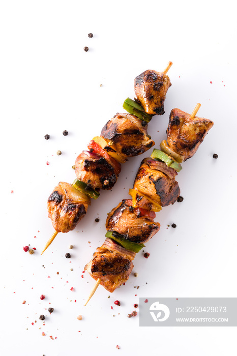 Chicken shish kebab with vegetables isolated on white background. Top view