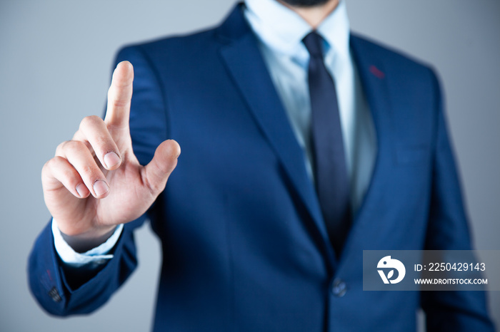 man finger in screen on gray background