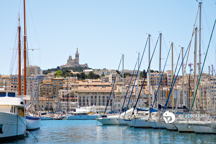 Aerial panoramic view on basilica of Notre Dame de la Garde and old port in Marseille, France. Prove