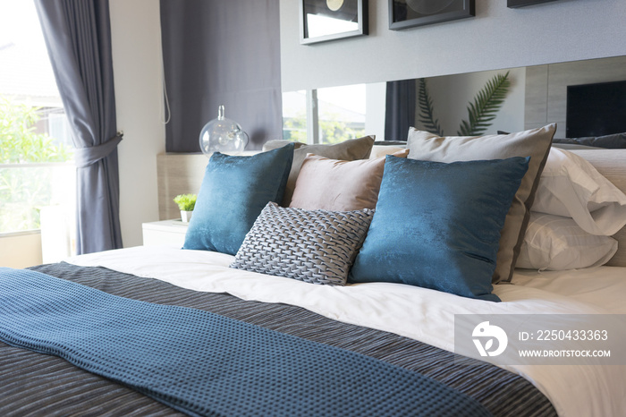 luxury set of blue and gray pillows on bed