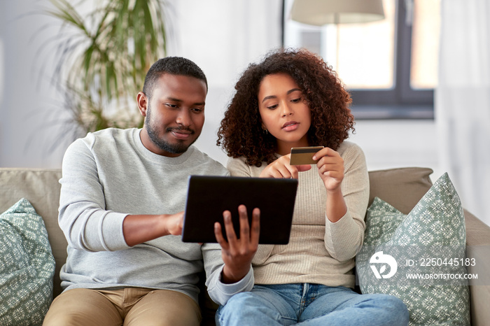 family, technology, online shopping and people concept - african american couple couple with tablet 