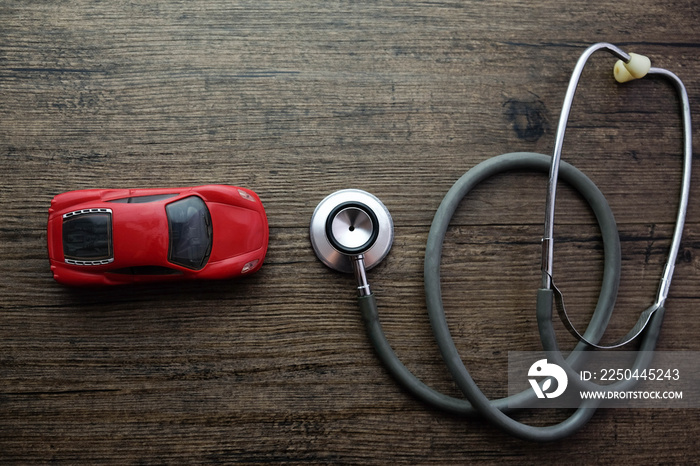 Stethoscope and car on the wooden background, Concept of car check-up, repair and maintenance..