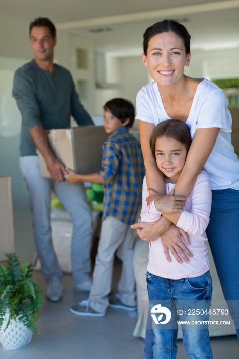 Portrait happy family moving into new house