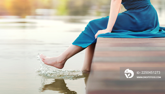 Unplugged Life or Human Living with Nature Concept. Young Woman Relaxing by Riverside. Sitting on De