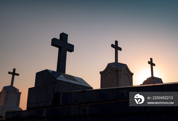 Cemetery or graveyard in the night with dark sky. Headstone and cross tombstone cemetery. Rest in pe