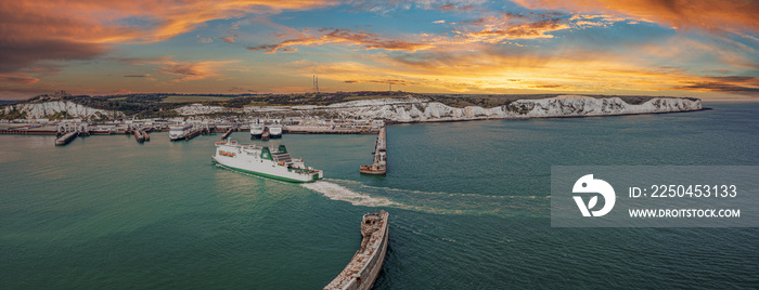 Aerial view of the Dover harbor with many ferries and cruise ships entering and exiting Dover, UK.