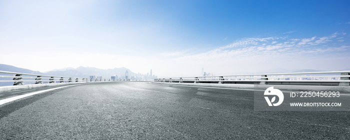 empty asphalt road with cityscape of modern city