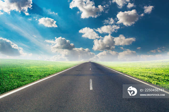 speed highway through the field. asphalt-paved road