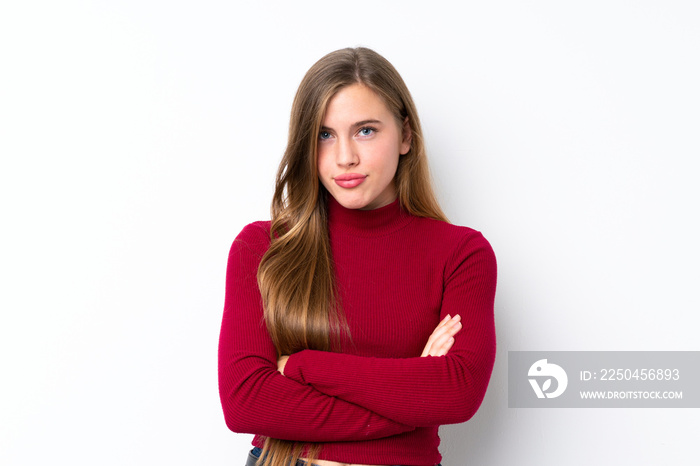 Teenager blonde girl over isolated white background feeling upset