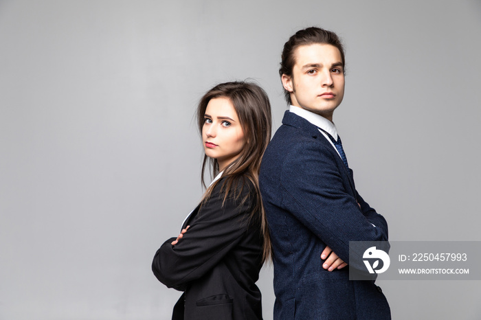 Business man and woman standing back to back isolated on white background. Teamwork concept