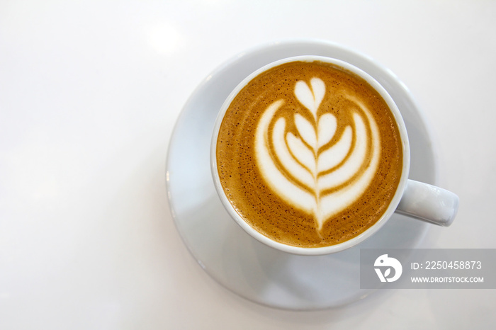 Top view of coffe in a white cup.