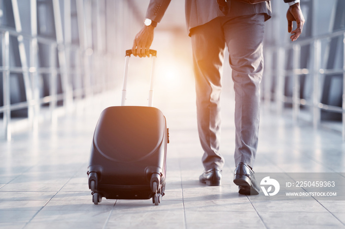 Businessman Carrying Suitcase, Walking Through Passenger Boarding Bridge