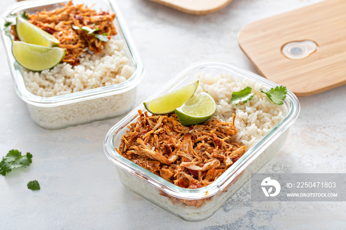 Meal prep containers with pulled chicken with salsa and rice