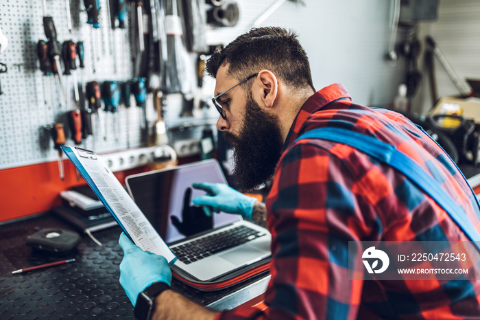 Professional bus mechanic working in vehicle repair service.