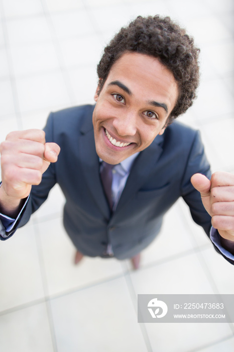 Portrait confident businessman gesturing with fists