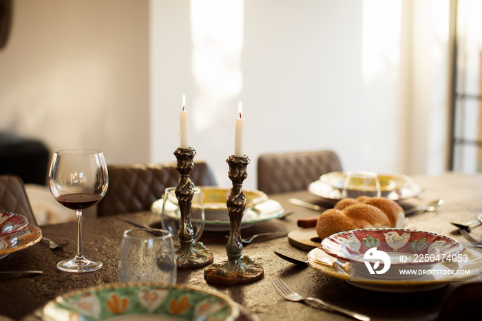 High angle view of place setting on dining table against wall at home