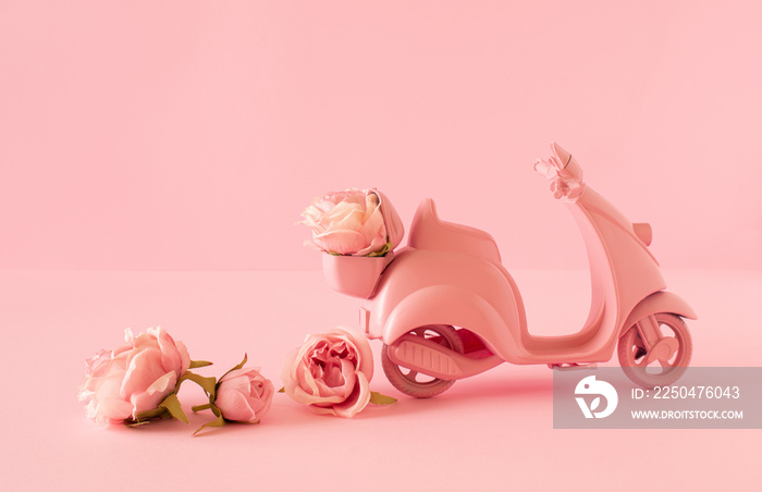 Creative composition of scooter and rose flowers on pastel background. Pink romantic concept. Minima