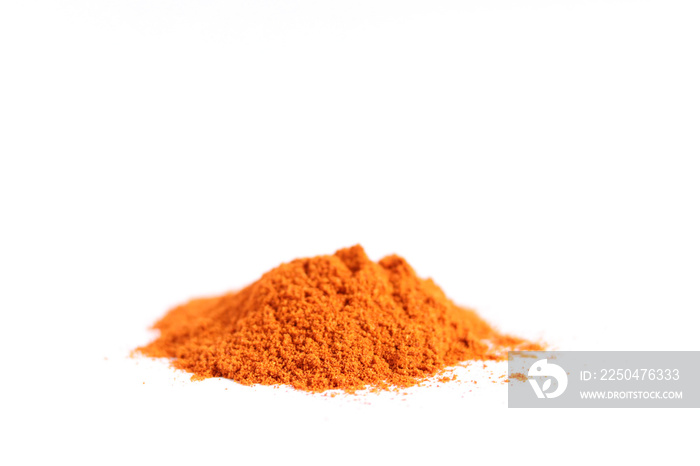 Heap red chili powder or paprika isolated on a white background