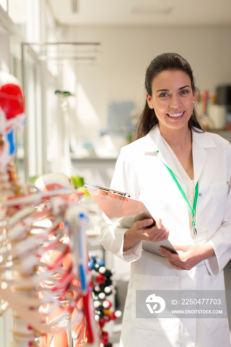 Portrait confident doctor with clipboard