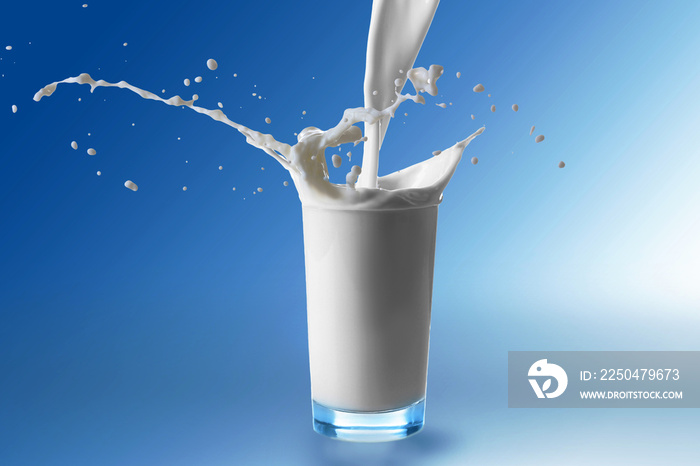 Pouring milk in glass on color background