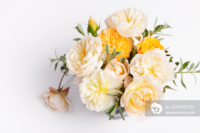 Festive flower composition on the white wooden background. Overhead view