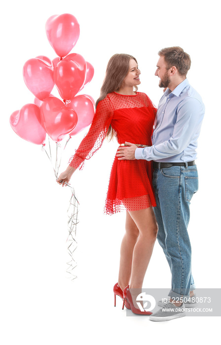 Happy young couple with heart-shaped balloons on white background. Valentines Day celebration