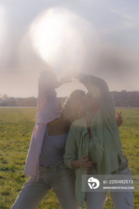 women in nature dancing