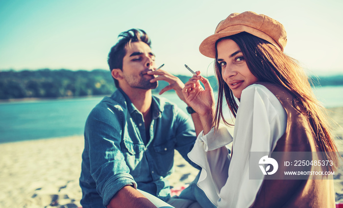 Beautiful young couple having fun on the beach. Lifestyle, love, dating, vacation concept