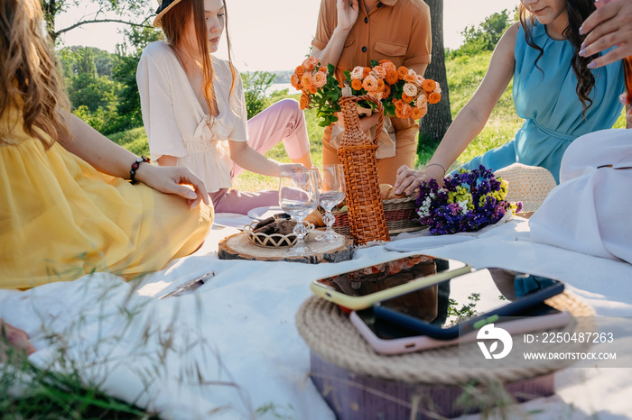 Digital Detox, time for disconnecting from electronic devices. Mobile phones on basket on picnic bac