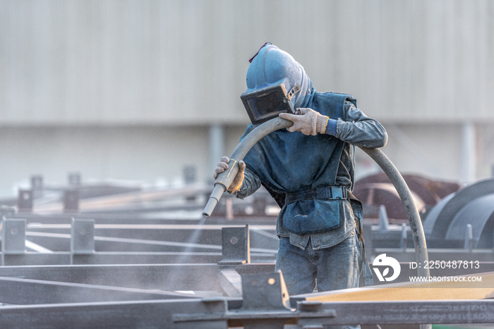 Sand blasting process, Industial worker using sand blasting process preparation cleaning surface on 