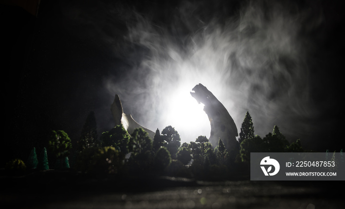 Animal bone in dark Halloween night with fog and light on background / Selective focus and space for