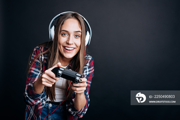 Cheeful involved girl playing video games