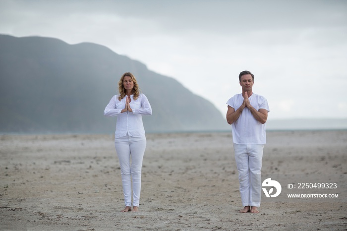 Mature couple doing meditation