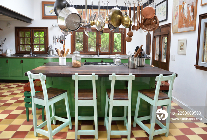 Utensils hanging over breakfast bar in house