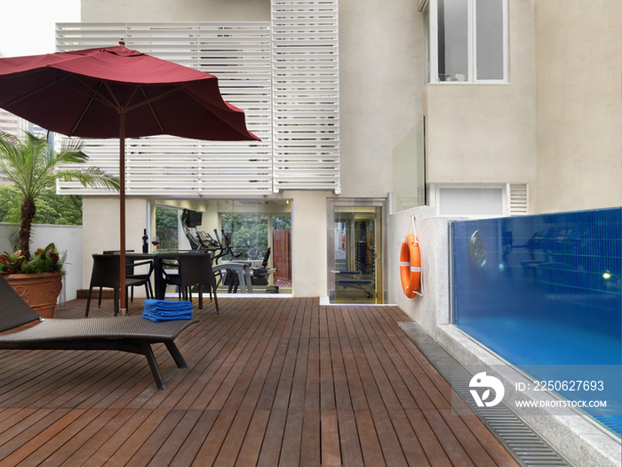 Backyard patio and swimming pool of house