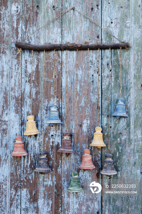 Clay Bells on a Weathered Door