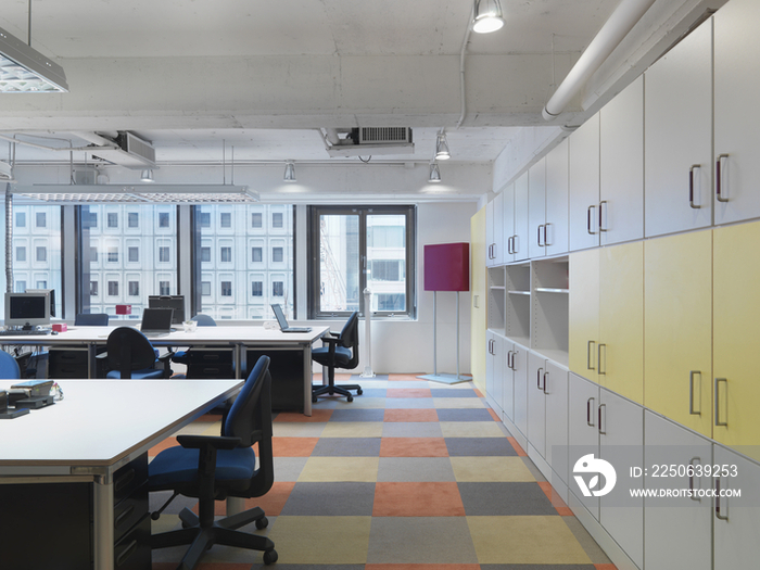 Interior of office with tables and chairs