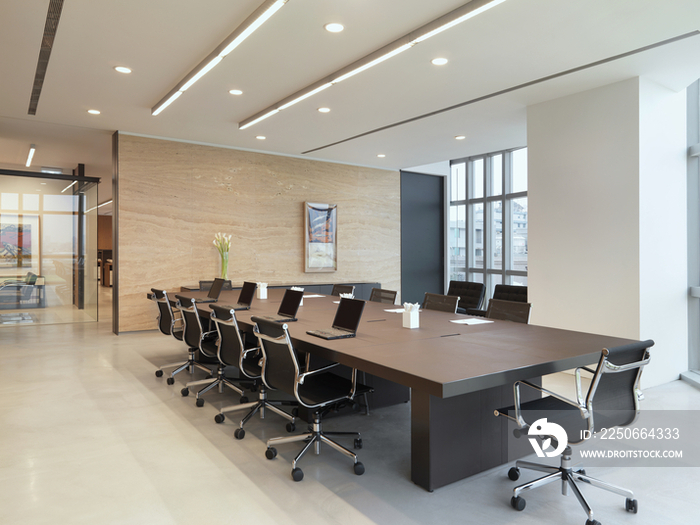 Laptops on conference table in office