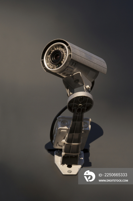 A security camera mounted on the wall of a building