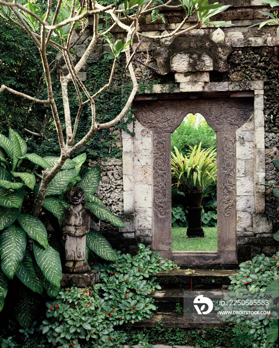 A garden in Bali, with balinese style gateBatu Kimbar estate, Sanur, Bal