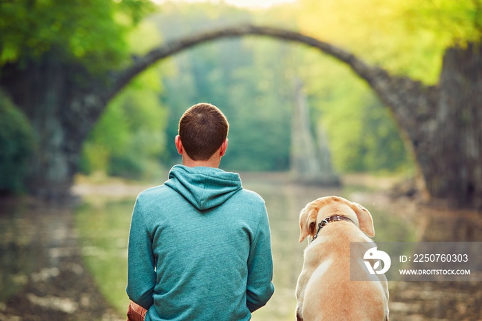 Pensive man sitting with his dog