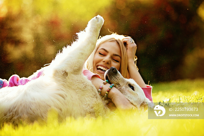 Woman enjoying park with dog