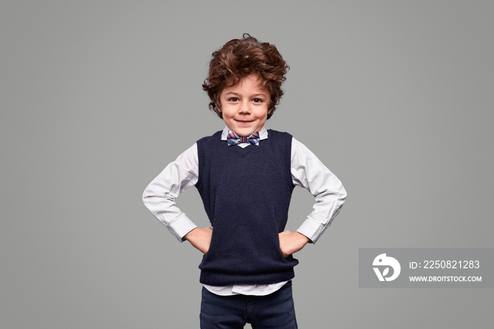 Confident schoolboy looking at camera