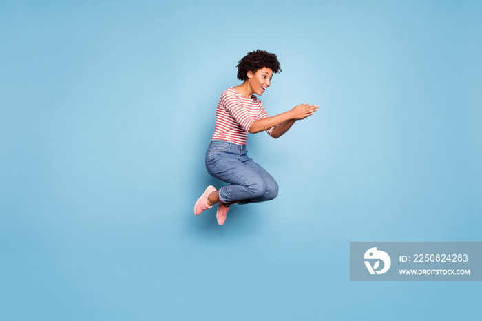 Full length profile side photo of excited cheerful afro american girl jump want dive in water wear c