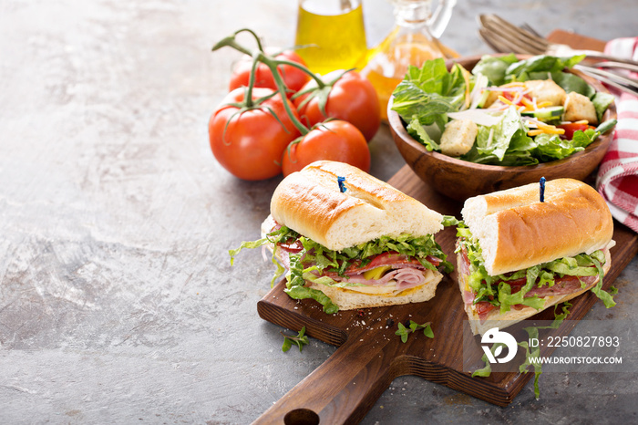 Italian meat sandwich with salad and chips for lunch