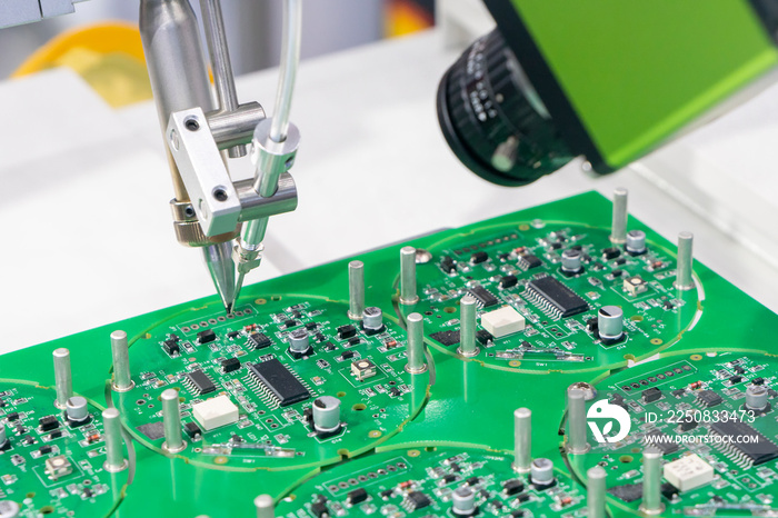 The robotic system for the soldering process with the electronics board. The electronics circuit boa